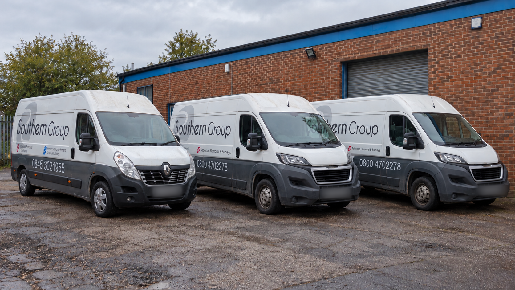Three Southern Group vans in a lineup, with license plates blurred
